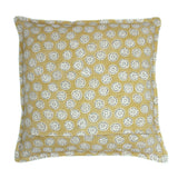 A yellow, cream and black linen cushion with a all-over repeat pattern.