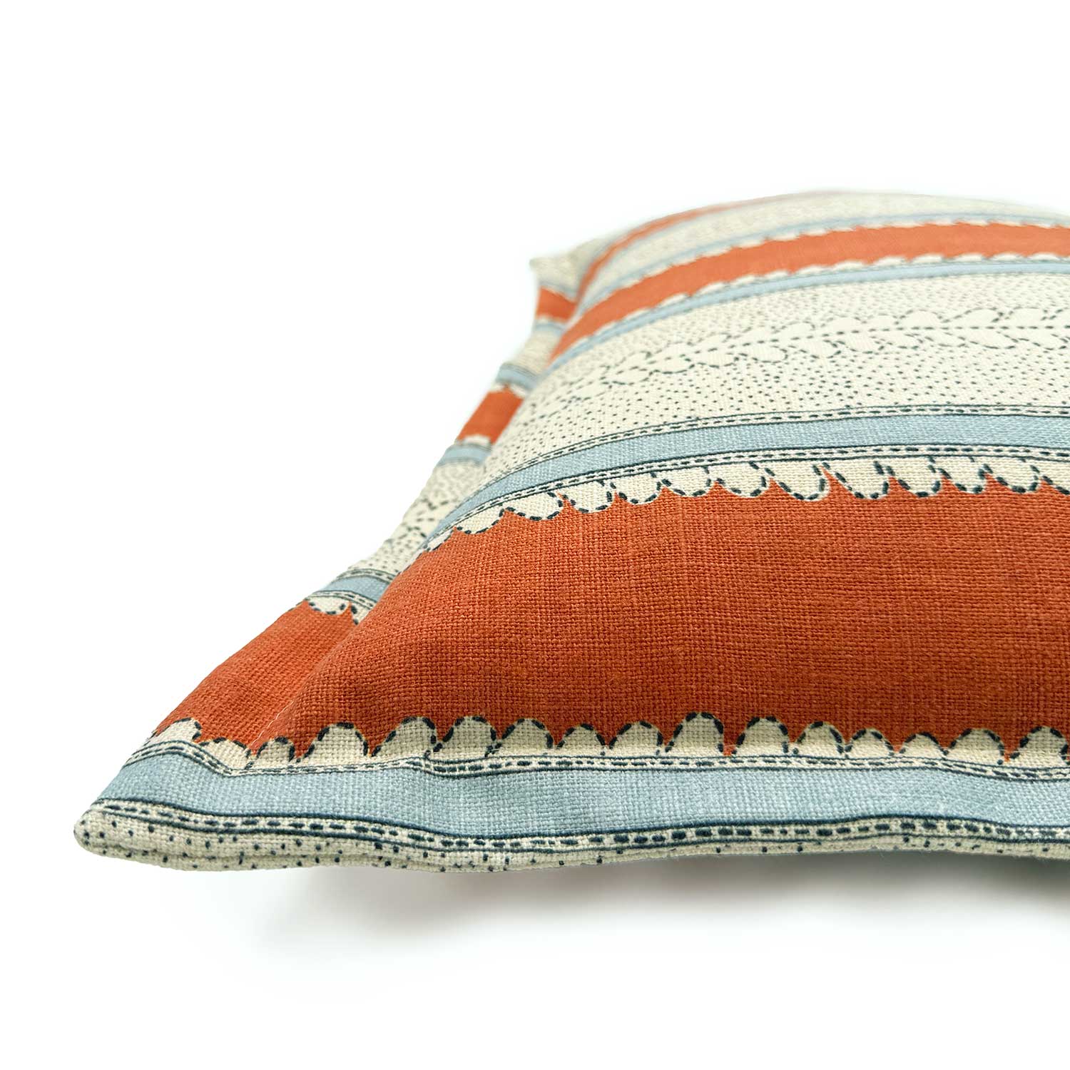 Close-up side view of Linwood cushion in Dimity, Rust, showing fabric texture and Oxford edge detail.