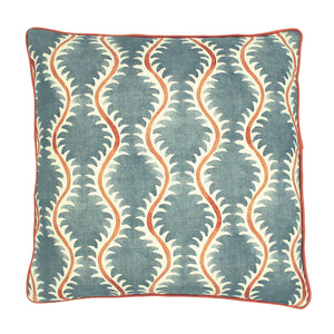 A blue, orange and cream linen cushion with a all-over repeat pattern and linen piping.