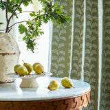 Oakleaf embroidery curtains on a green background with marble table.