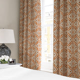 Linen curtain with a handcrafted-style print in orange