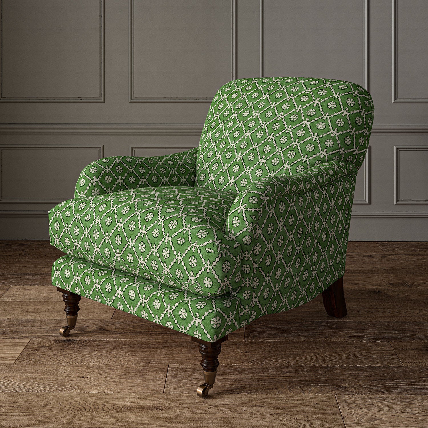 Armchair covered in a linen fabric with a hand block-style pattern in green, black and cream