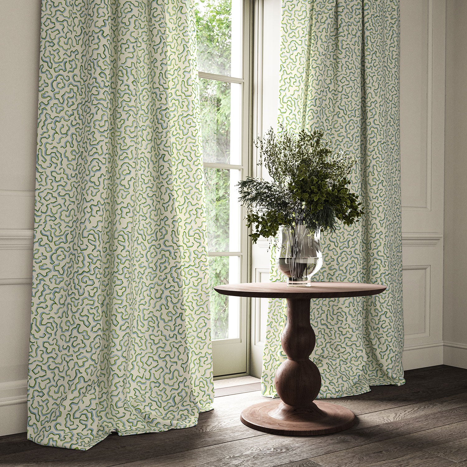 Curtains made from a printed linen fabric in blue, green, and off white featuring a feel of a classic animal print.