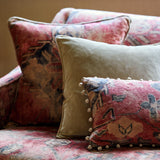 Cushions in a printed velvet fabric in red with the feel of a vintage rug.
