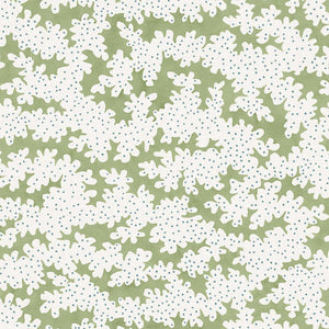 A printed linen fabric sample in green, blue and off white featuring a stylized coral pattern.
