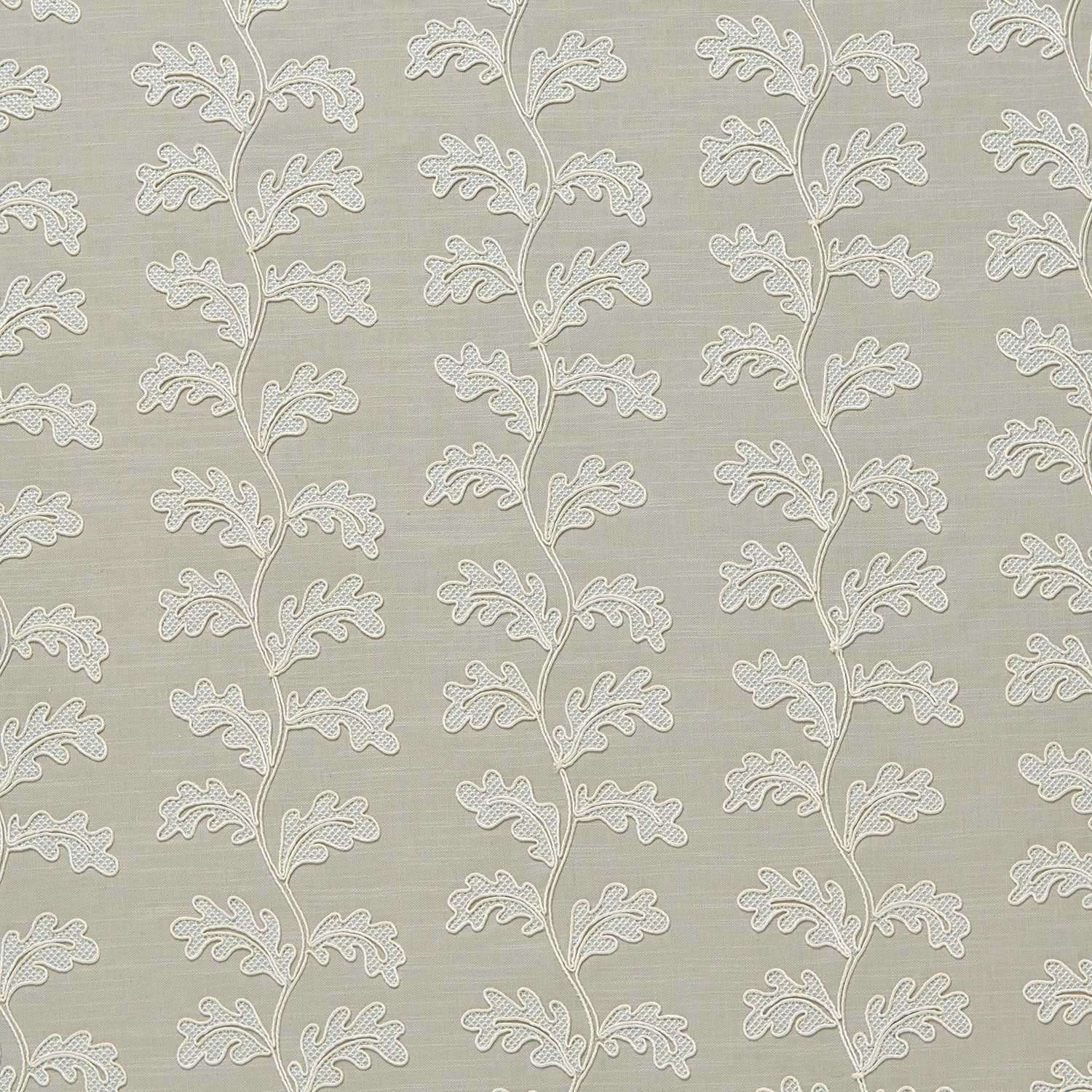 Decorative oakleaf embroidery on a natural background.