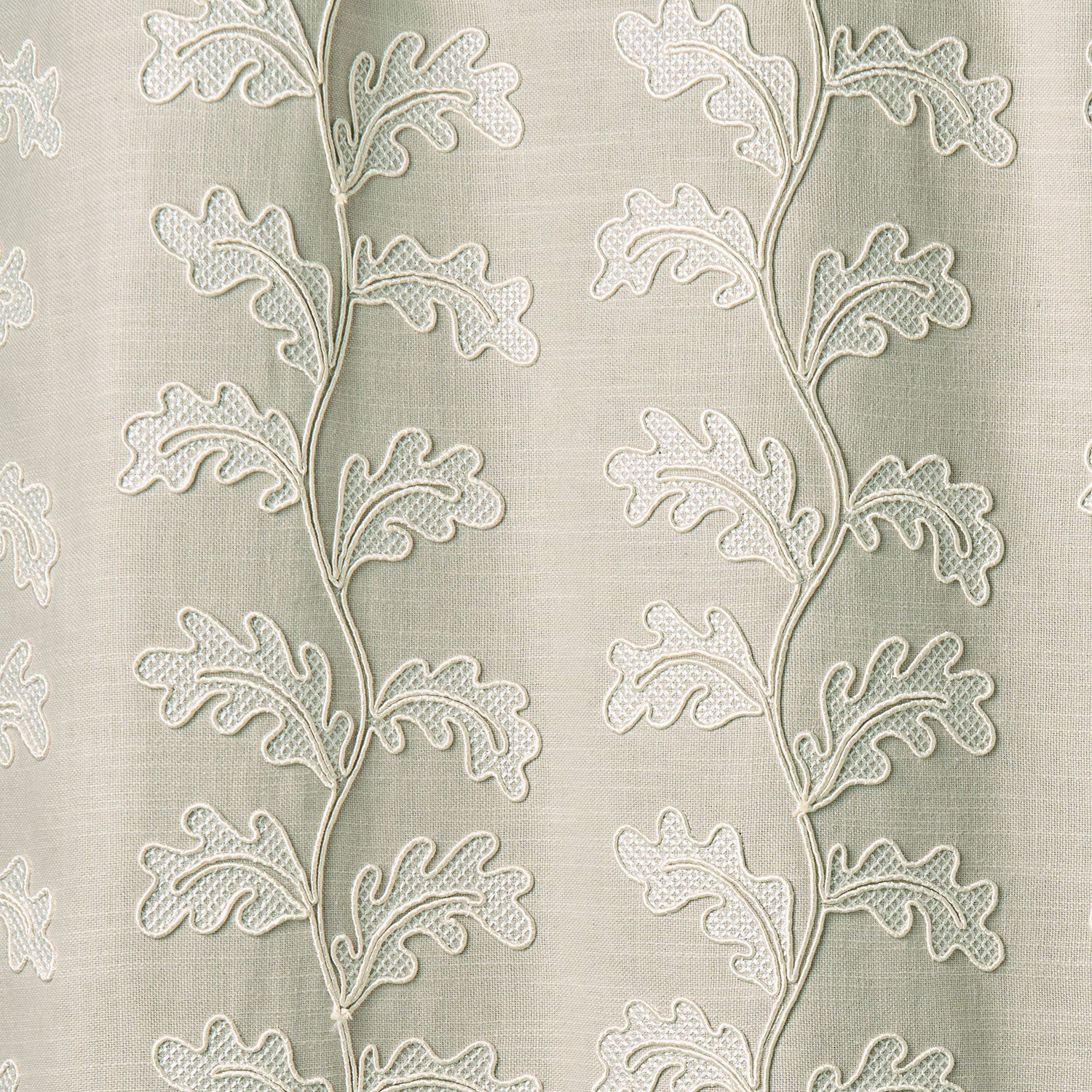 Decorative oakleaf embroidery on a natural background.