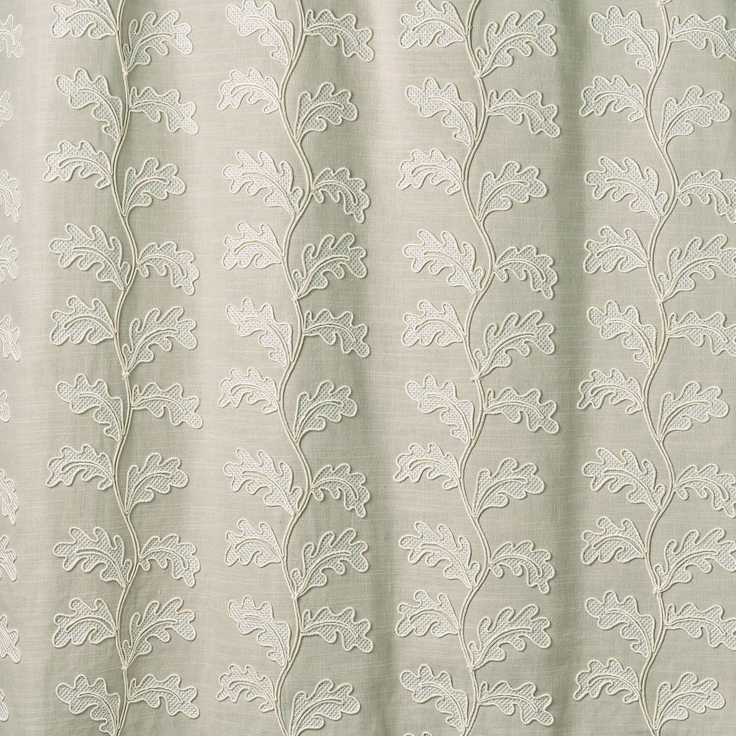 Decorative oakleaf embroidery on a natural background.