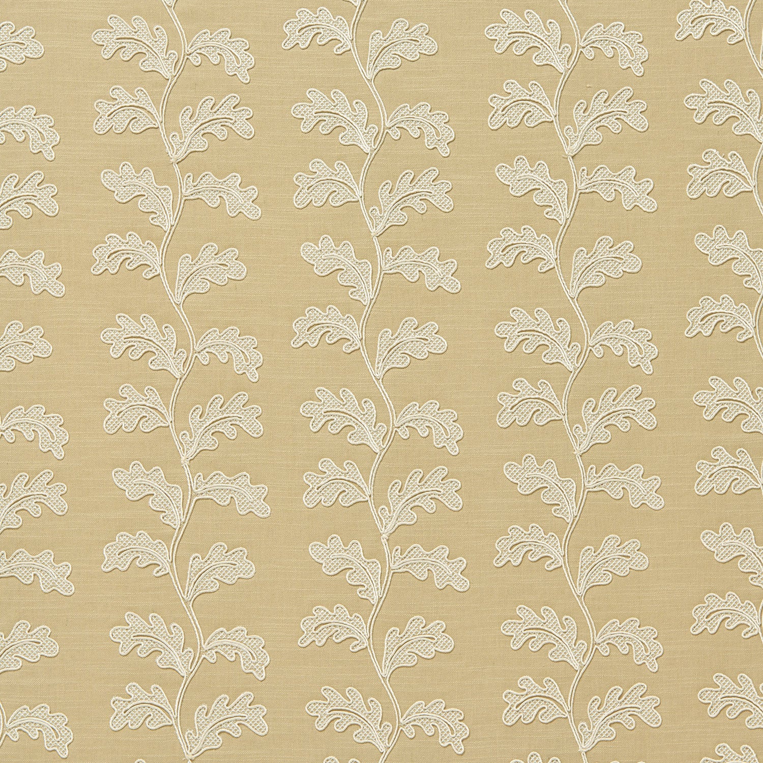 Decorative oakleaf embroidery on a beige background.