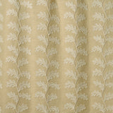 Decorative oakleaf embroidery on a beige background.