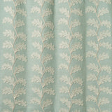 Decorative oakleaf embroidery on a blue background.