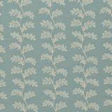 Decorative oakleaf embroidery on a blue background.