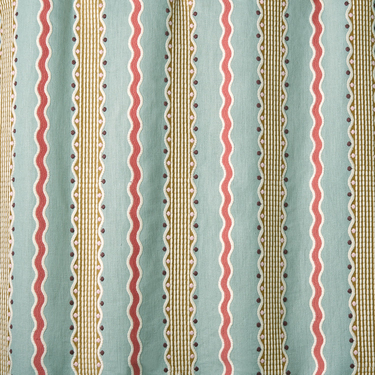 Embroidery fabric with vertical stripes in red, beige, and brown on a light blue background.