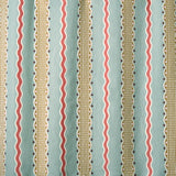 Embroidery fabric with vertical stripes in red, beige, and brown on a light blue background.