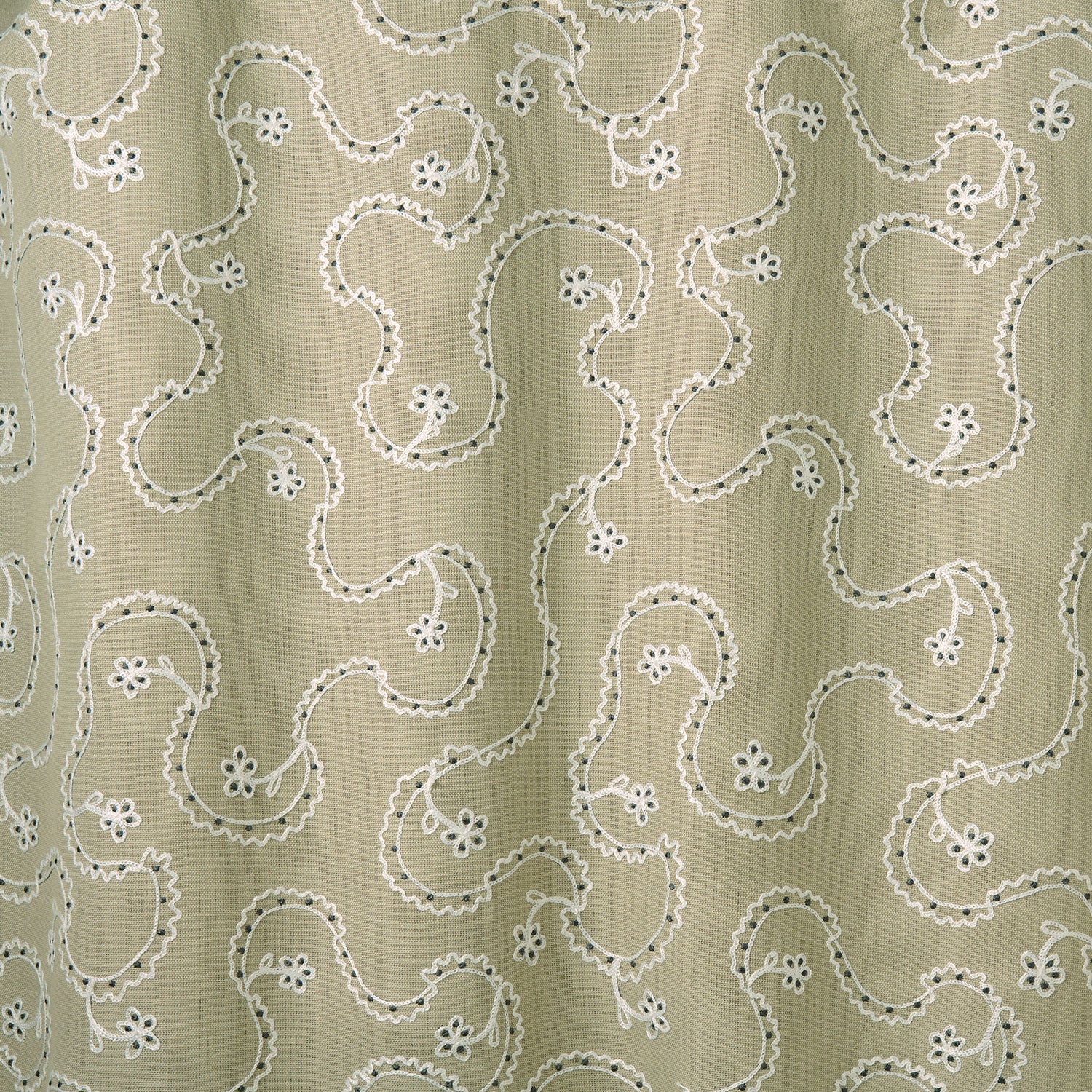 White embroidery pattern on a taupe background.