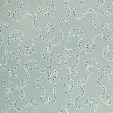 White embroidery pattern on a light blue background.