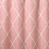 Geometric embroidery pattern with white lines on a pink background.