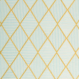 Geometric embroidery pattern with yellow and blue lines on a textured background.