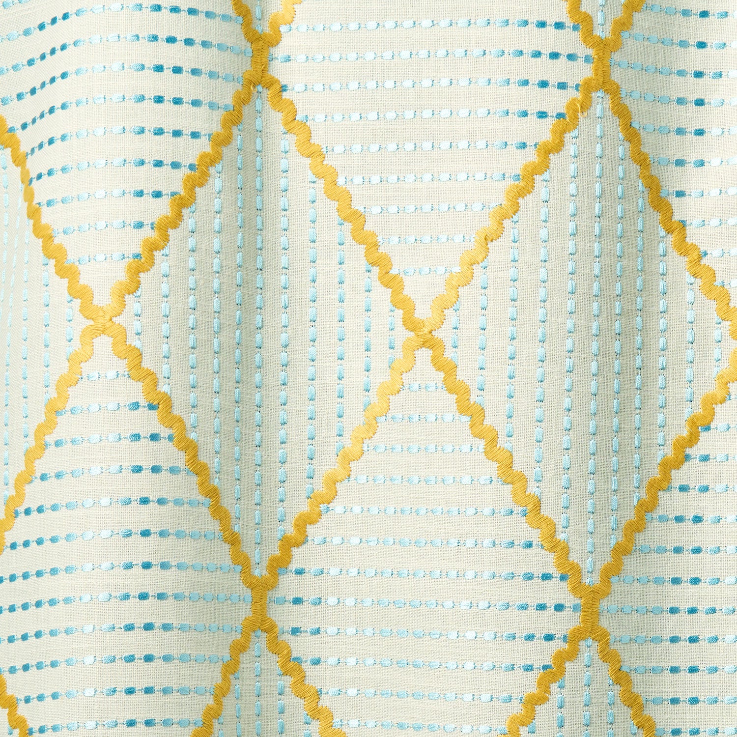 Geometric embroidery pattern with yellow and blue lines on a textured background.