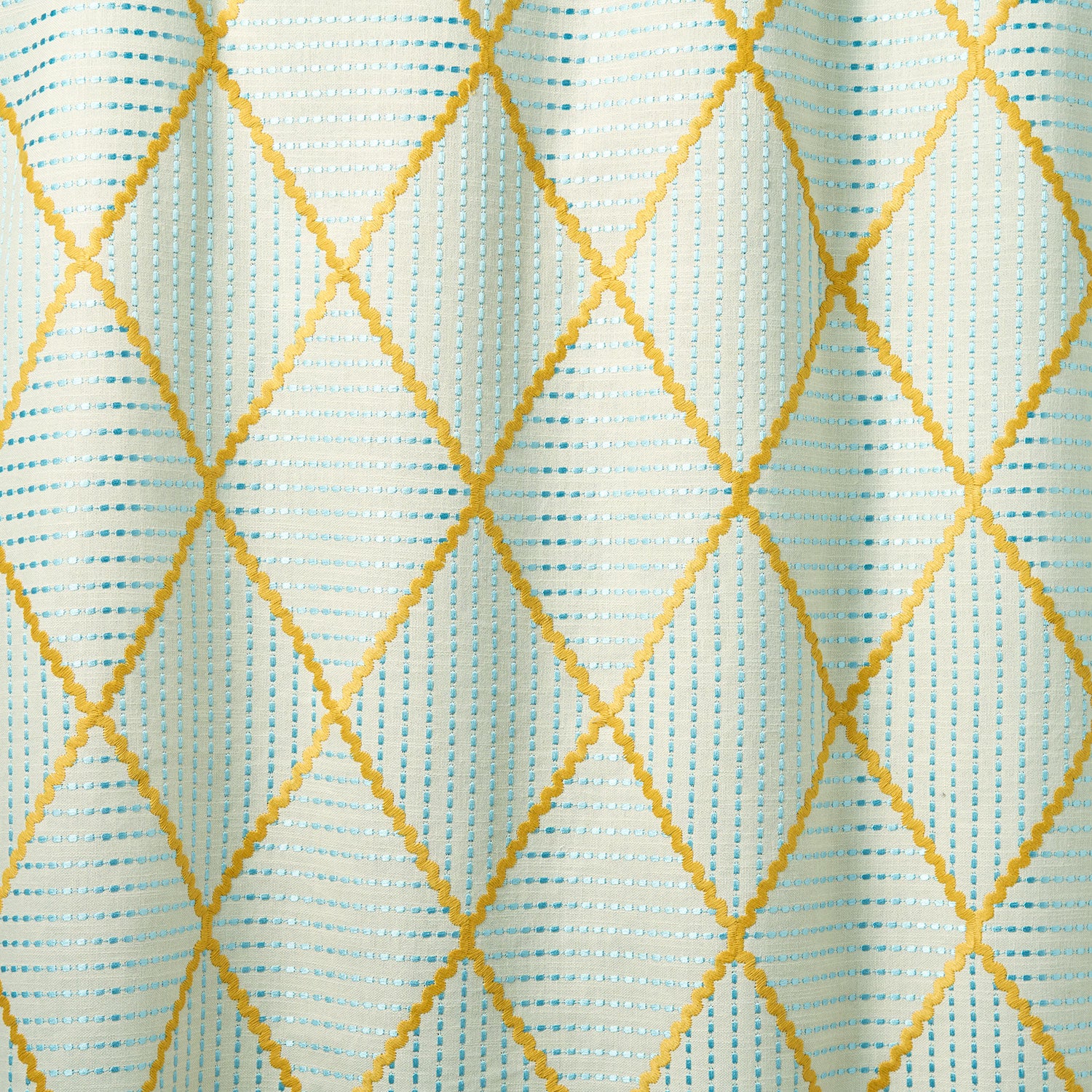 Geometric embroidery pattern with yellow and blue lines on a textured background.
