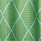 Geometric embroidery pattern with green and blue lines on a green background.