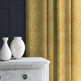 Curtain in yellow and off-white woven fabric featuring a geometric pattern.