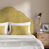 Headboard upholstered in a yellow and off-white woven fabric featuring a geometric pattern.