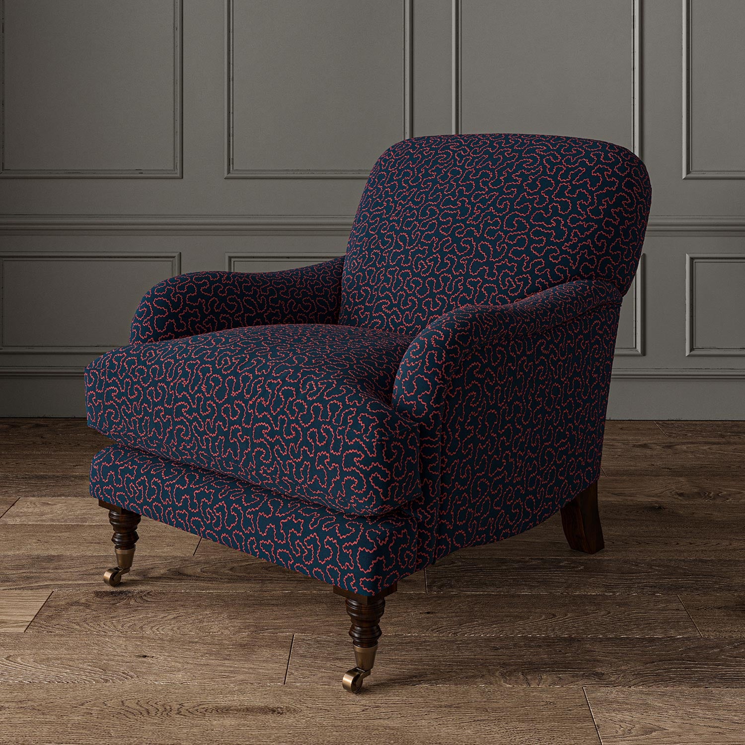 Chair upholstered in a blue and red woven fabric featuring a wavy pattern.