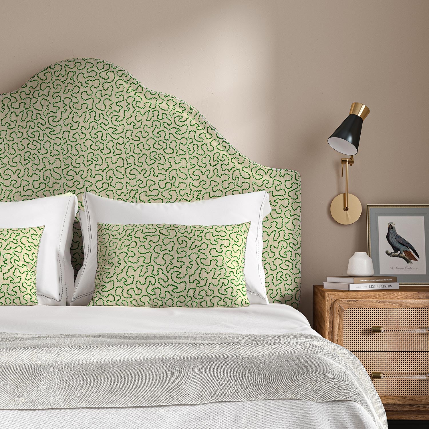Headboard upholstered in a green and off-white woven fabric featuring a wavy pattern.