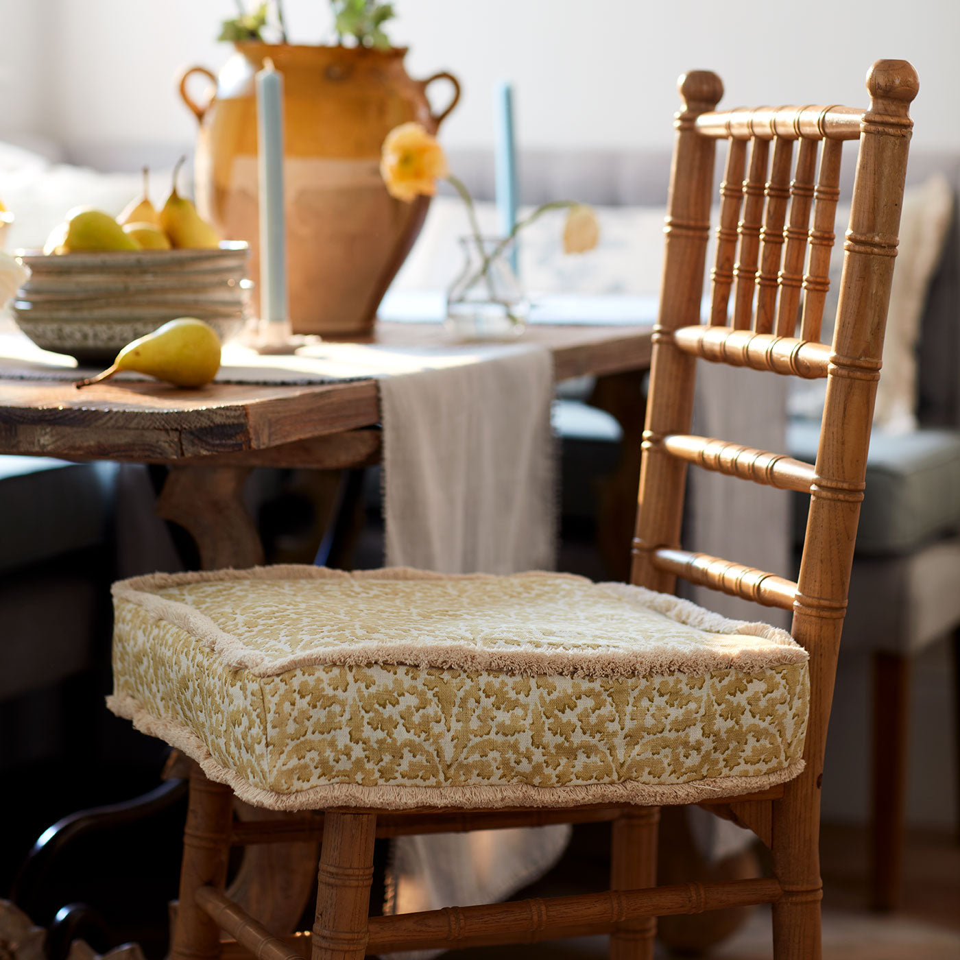 Printed linen fabric – damask-style pattern in yellow and cream – on a cushion