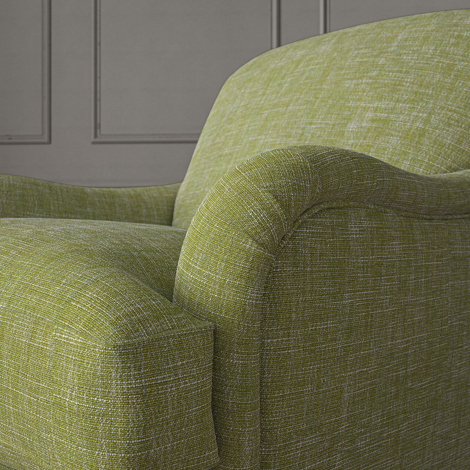 Green chair upholstered in a versatile woven fabric.