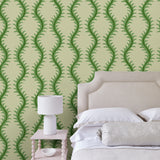 Luxurious wallpaper featuring stylised ferns and wavy lines in green and cream.