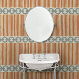 Bathroom with a chain-link wallpaper with different-sized blue and brown stripes.