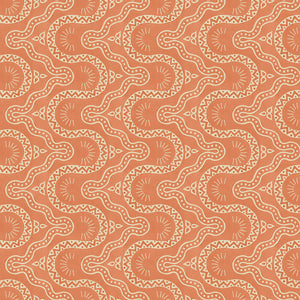 Sitting room with a orange geometric wallpaper.