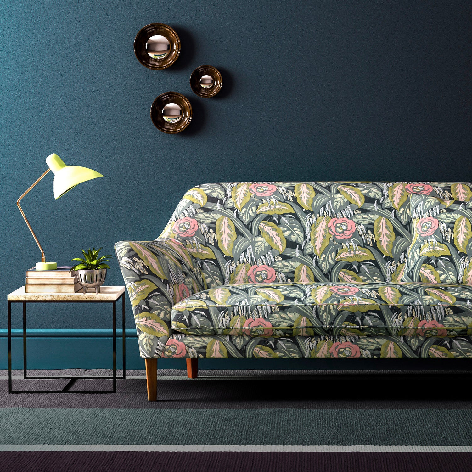 Sofa covered in a floral-style printed velvet fabric.