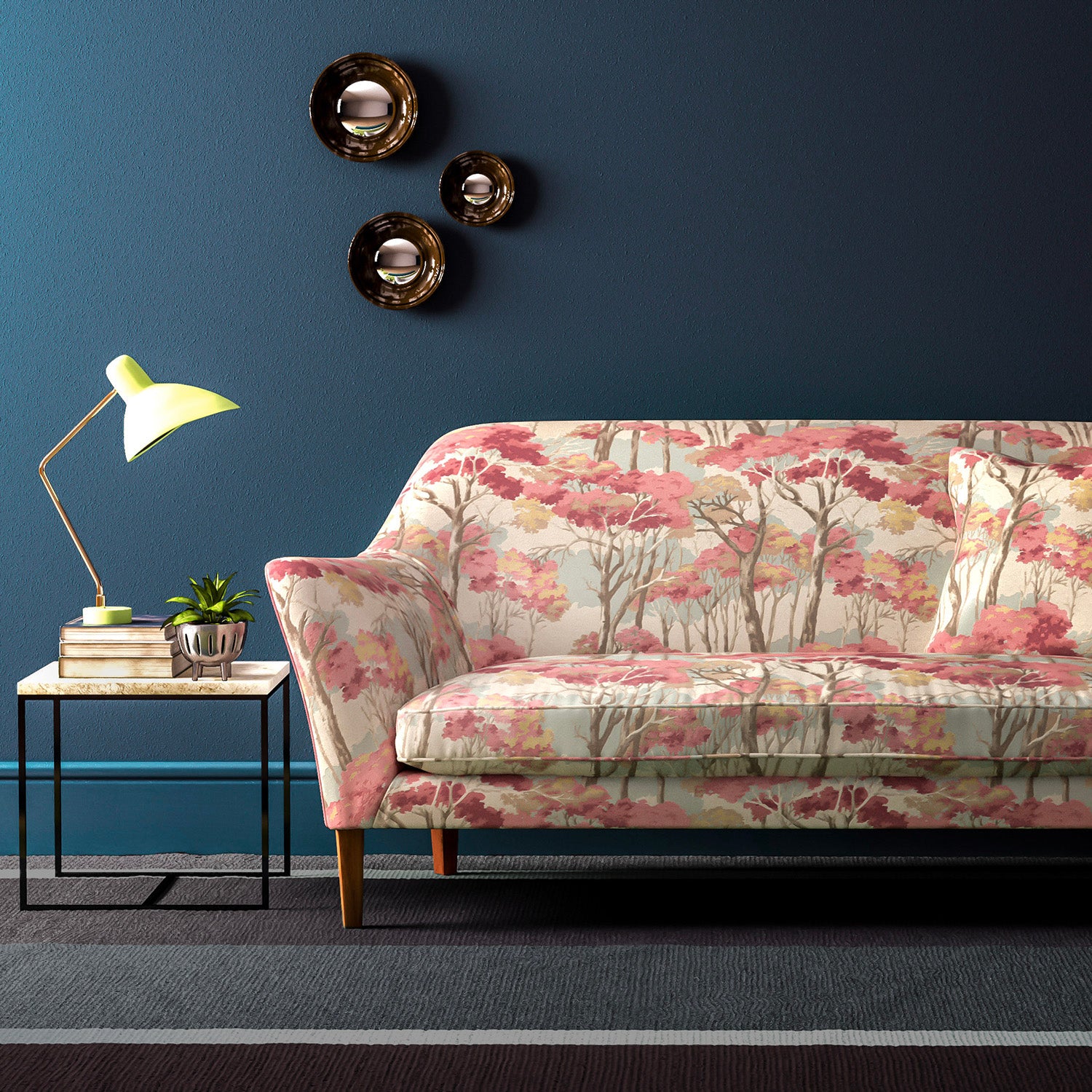 Sofa covered in a printed velvet upholstery fabric showcasing a pink Japanese tree design.