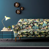 Sofa covered in a printed velvet fabric featuring a Japanese-style toile in blue and yellow.