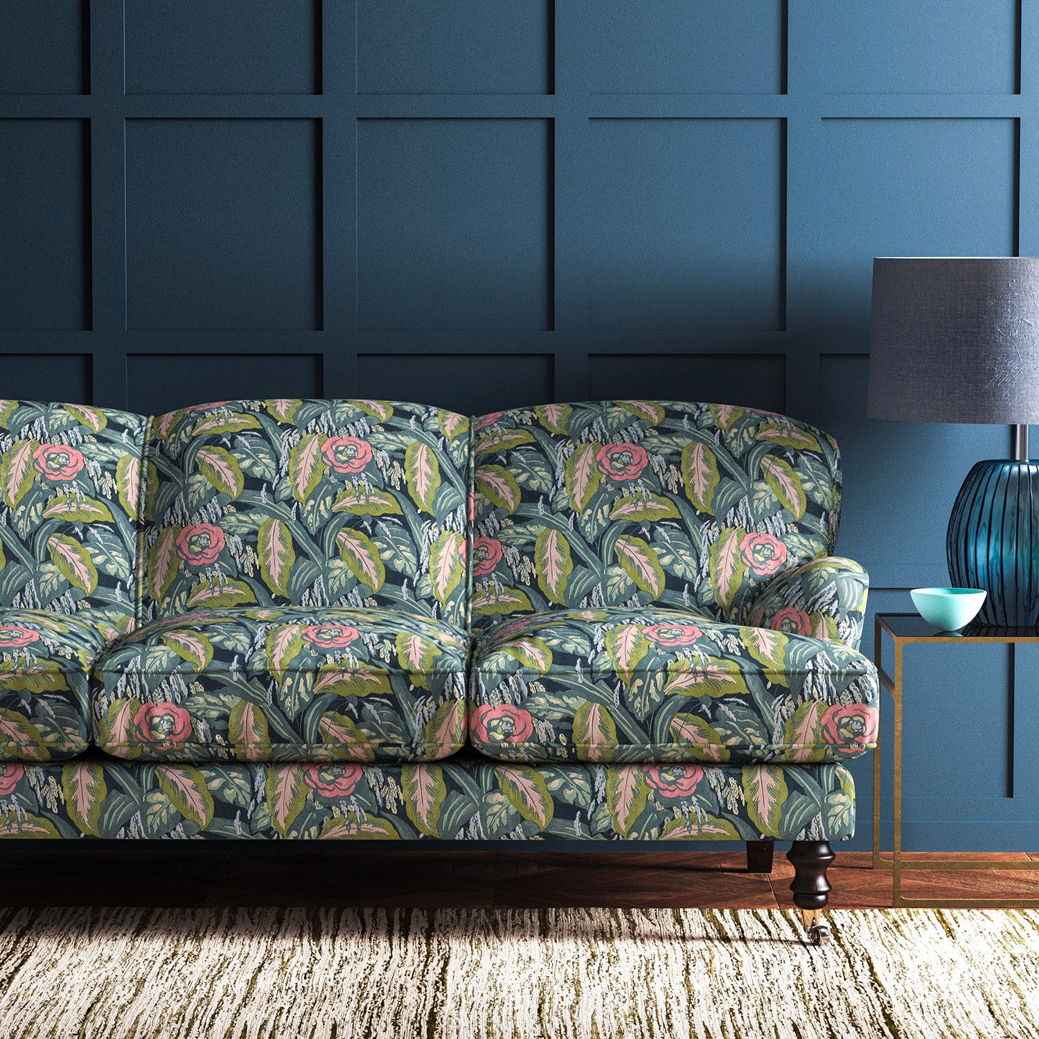 Sofa covered in a floral-style printed velvet fabric.