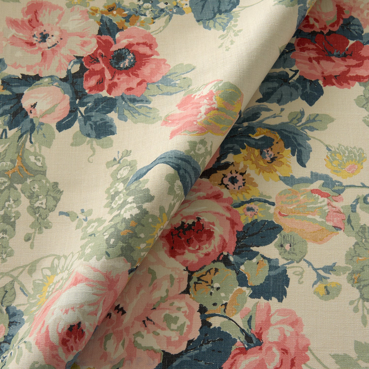 Printed linen fabric with bouquets of roses in gentle pinks and reds.