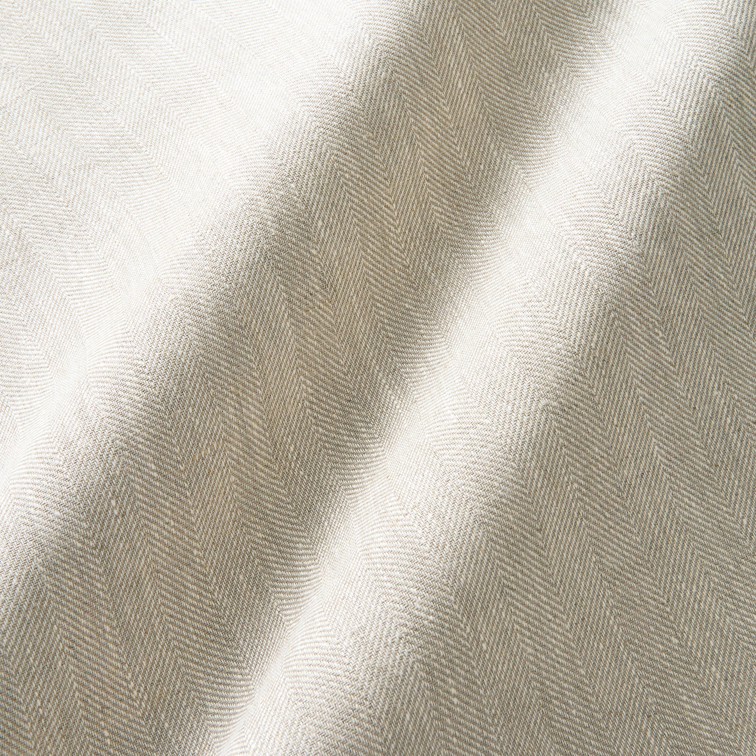 Timeless herringbone pattern on a light and breezy linen fabric – ideal for curtains and cushions.