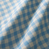 A versatile checked linen fabric in Cornflower for curtains, blinds, and cushions.