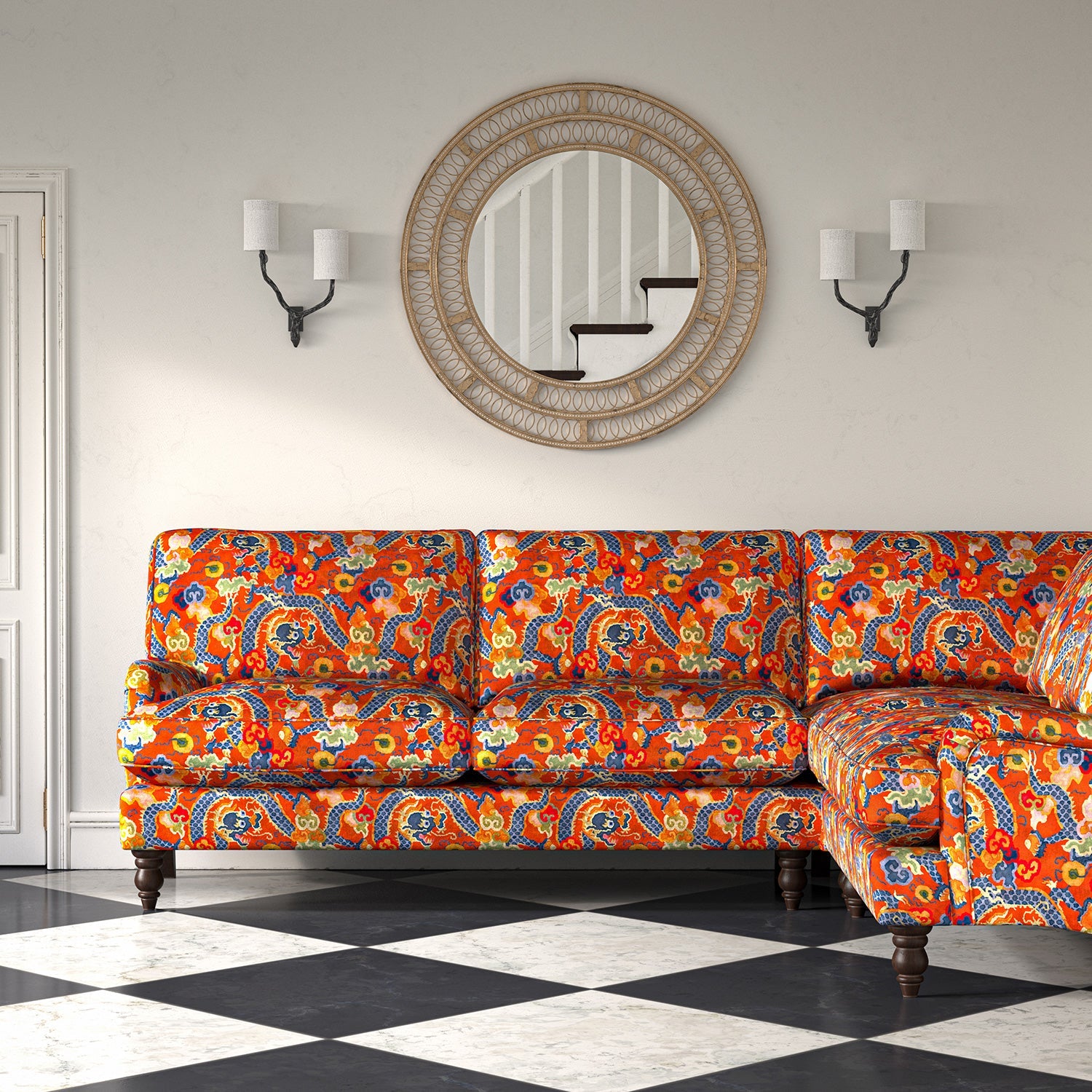 Velvet sofa upholstered in a printed velvet fabric with a intricate mirror dragon design in orange colours.