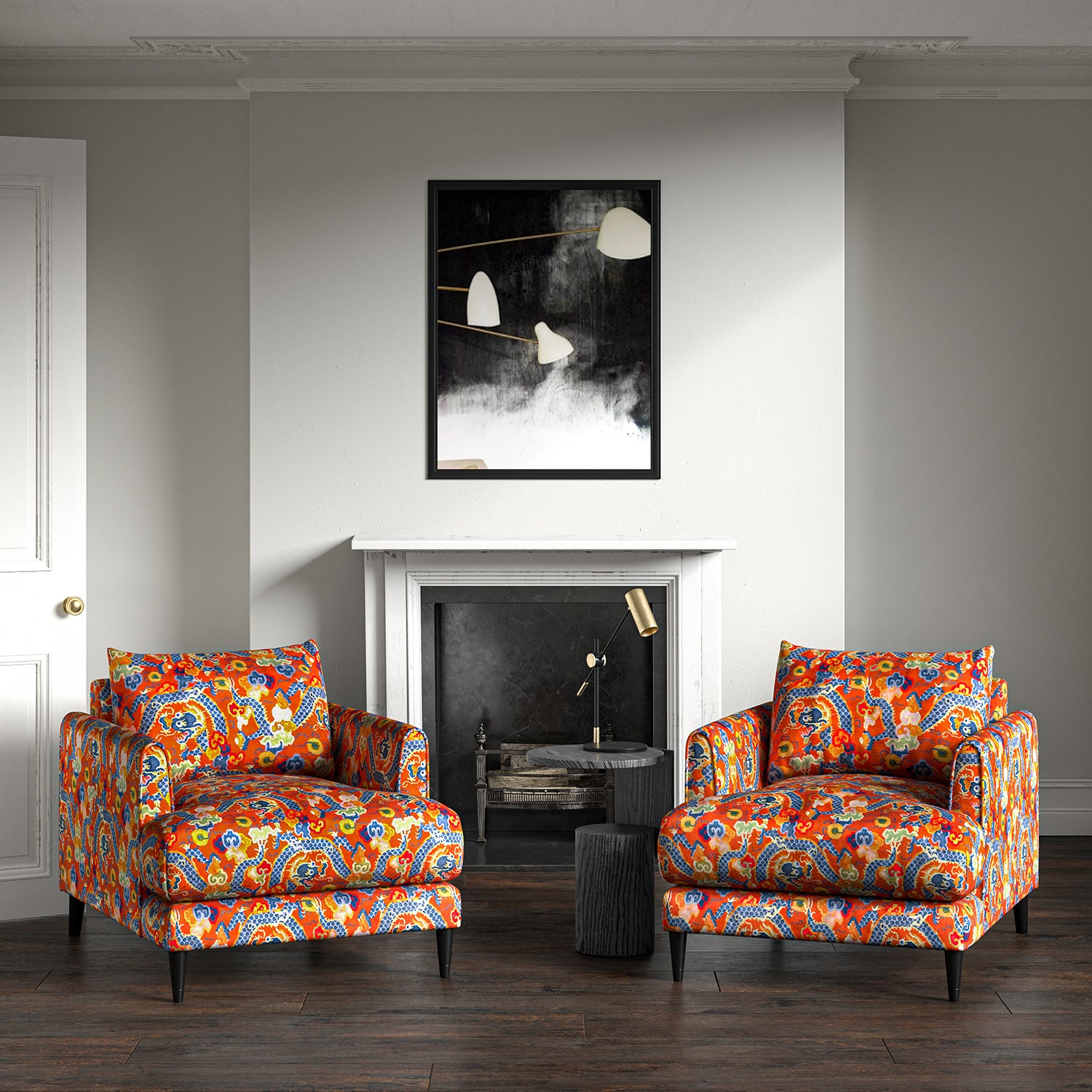 Velvet armchairs upholstered in a printed velvet fabric with a intricate mirror dragon design in orange colours.