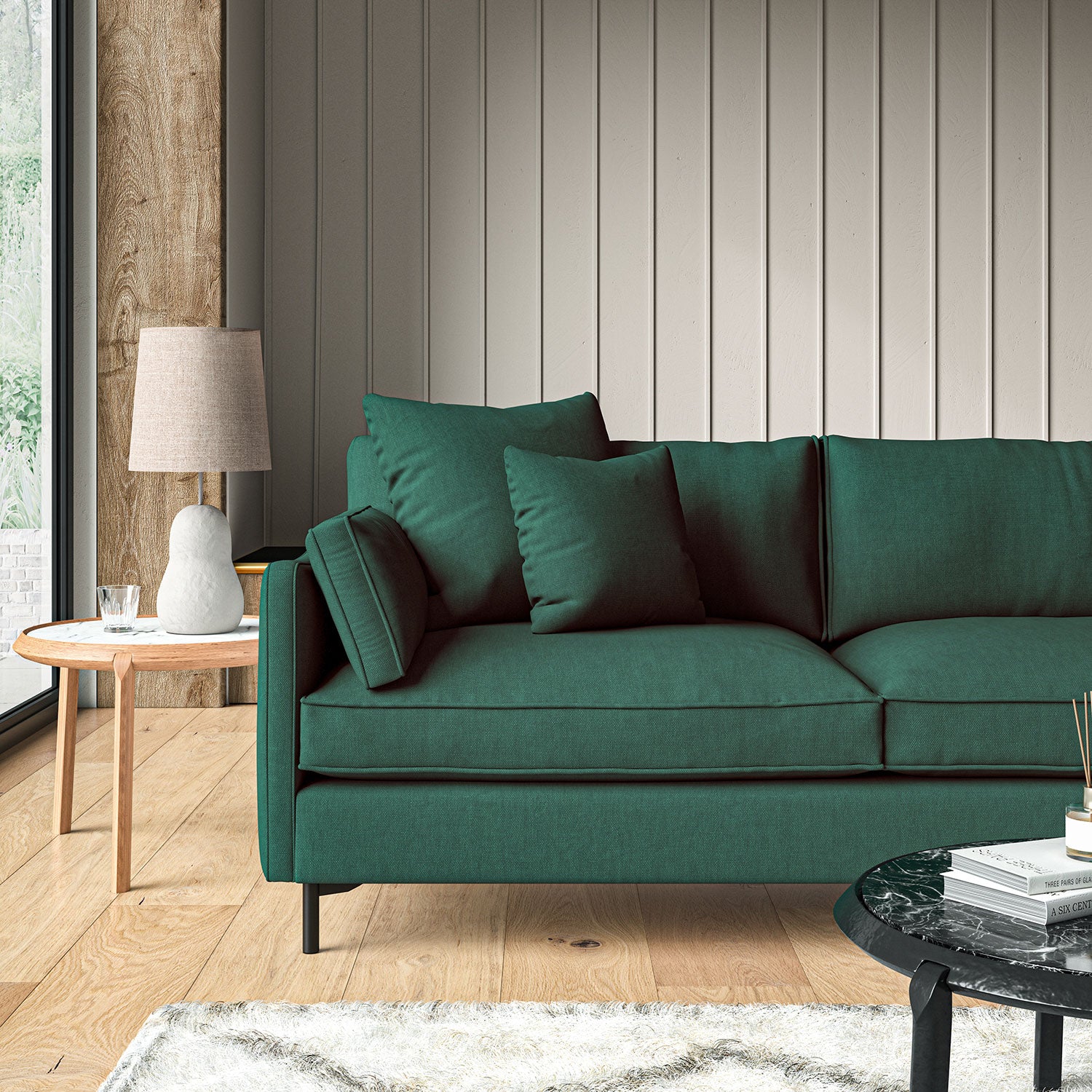 Sofa upholstered in Forest linen fabric