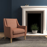 Chair in a dark orange herringbone wool upholstery fabric