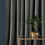 Curtain in a smokey blue herringbone wool fabric