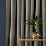 Curtain in a dark grey herringbone wool fabric