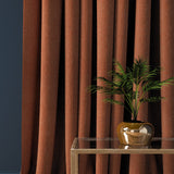 Curtain in a orange herringbone wool fabric
