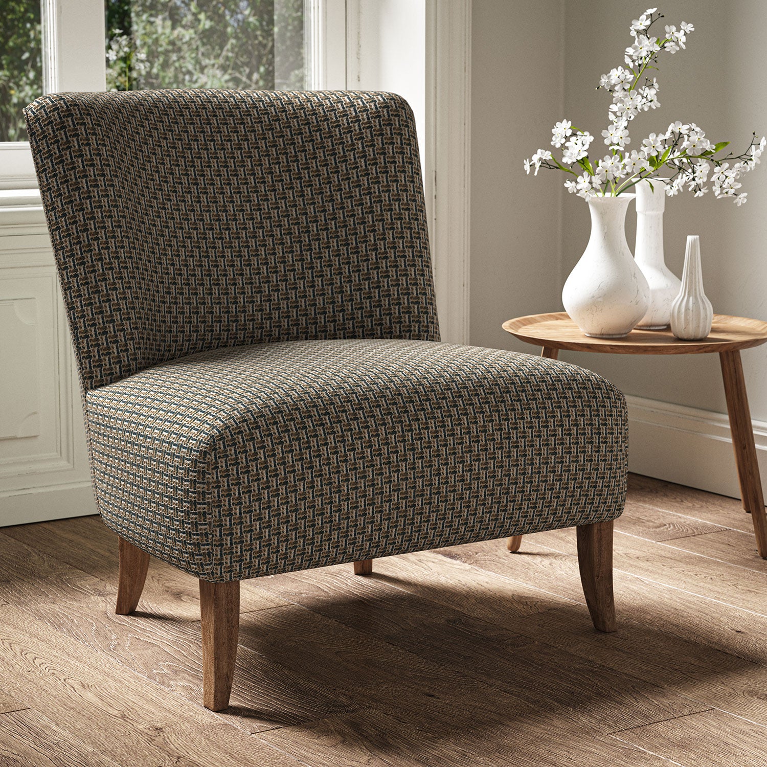 Armchair in a printed linen fabric with textural weave pattern in brown colours.