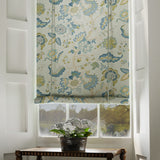 Blind in a printed linen fabric with tree of life design in blue and green colours.